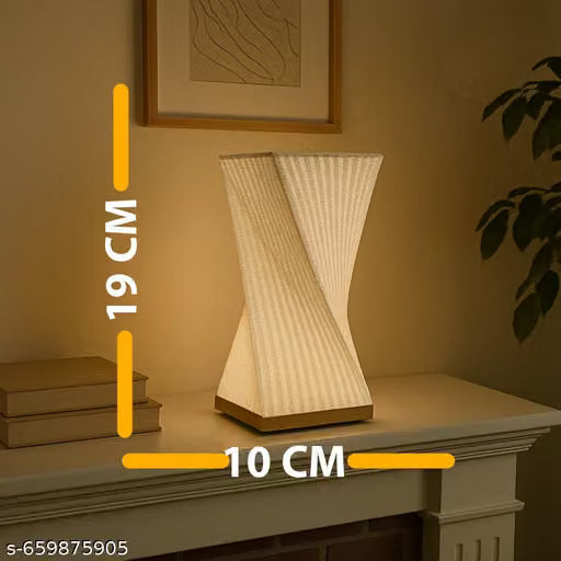 A stunning 3D-printed centerpiece, the lamp’s abstract inverted pyramid structure pairs perfectly with light wood furniture, creating a serene and comfortable lighting layer for guests.